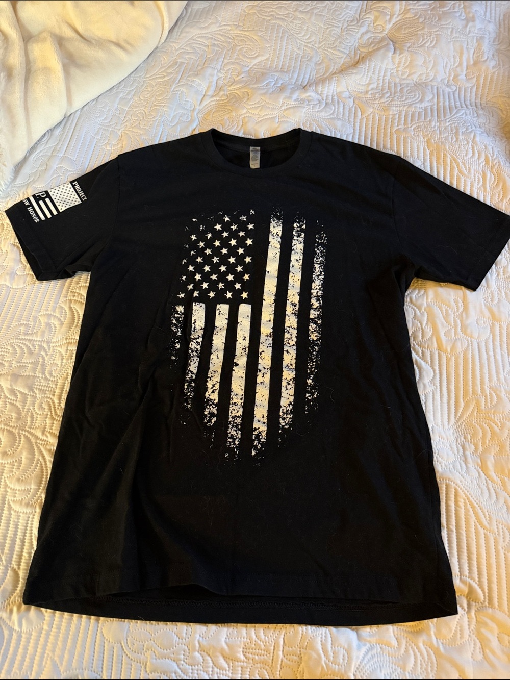Next Level Apparel Black Short-Sleeve Tee with Distressed White Flag Graphic